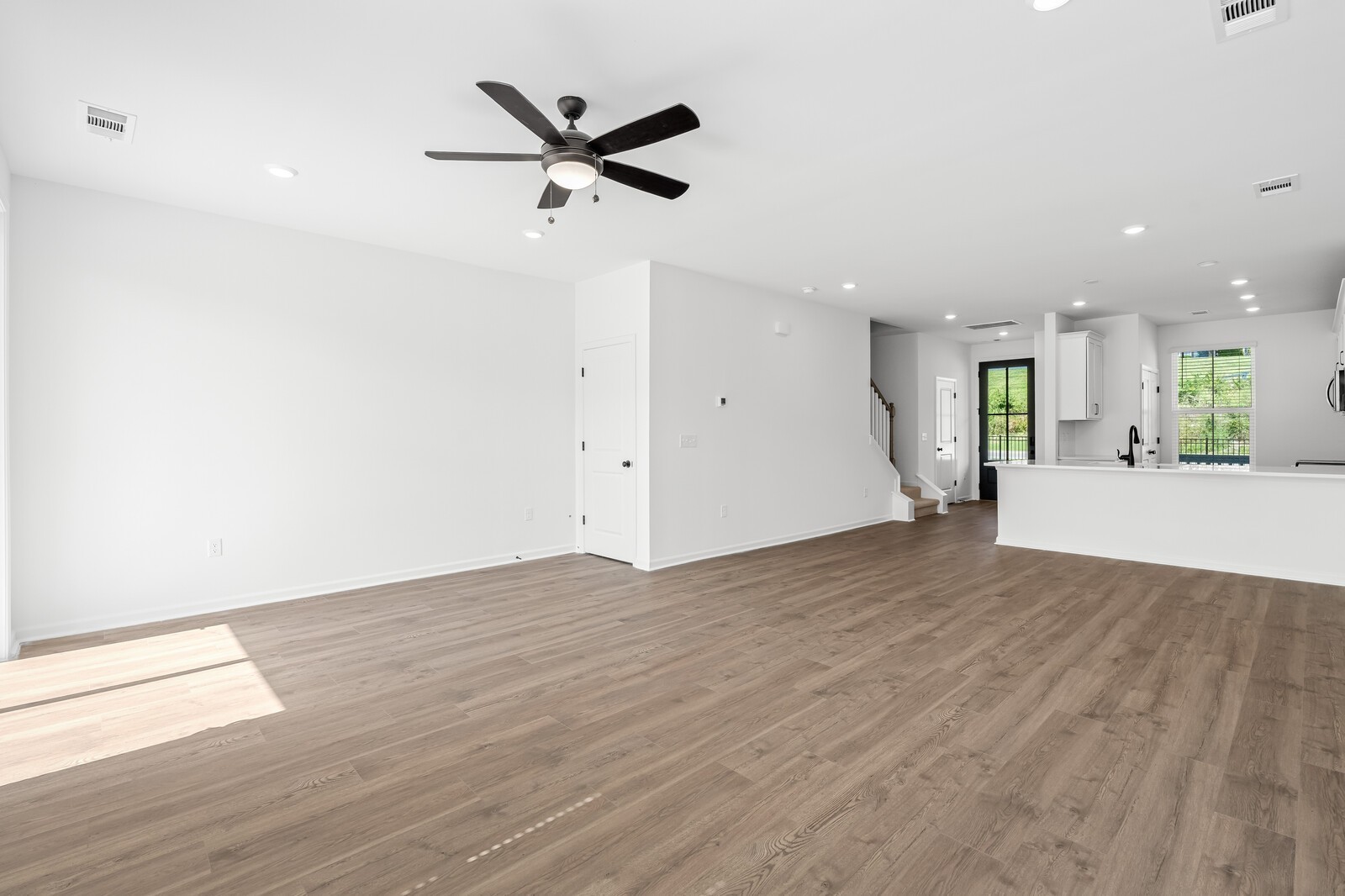 406 Blair Road Smyrna, TN 37167 - Photo 13 of 28 an empty room with wooden floor and windows