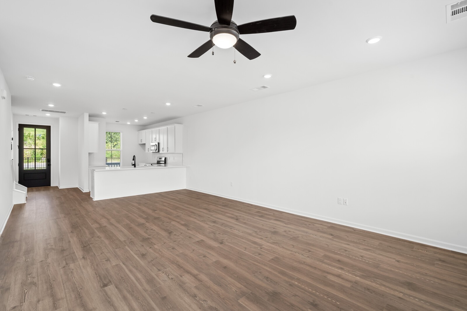 406 Blair Road Smyrna, TN 37167 - Photo 14 of 28 a view of kitchen and hall with wooden floor