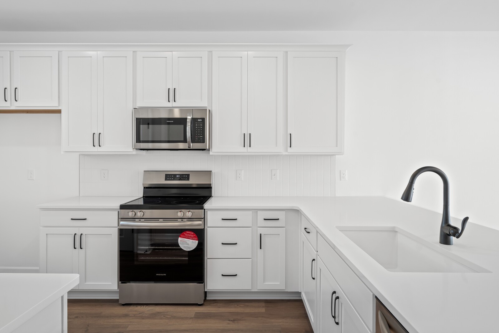 406 Blair Road Smyrna, TN 37167 - Photo 6 of 28 a kitchen with white cabinets and stainless steel appliances
