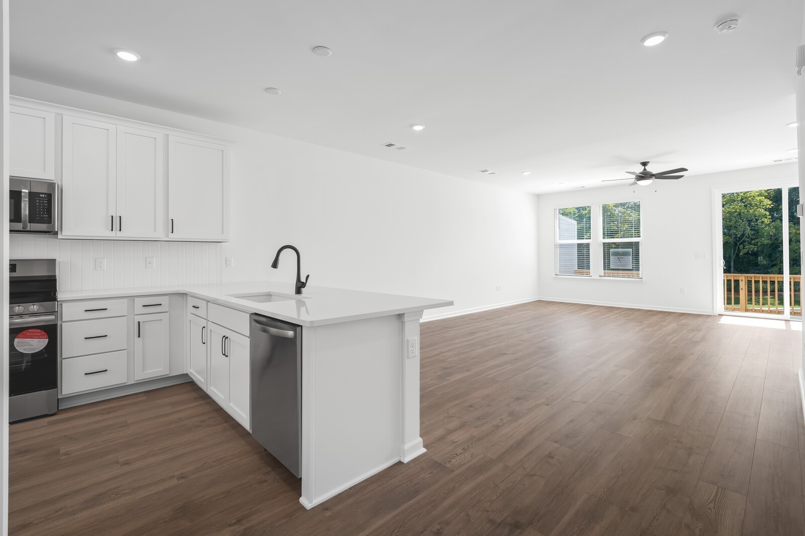 406 Blair Road Smyrna, TN 37167 - Photo 9 of 28 a kitchen with cabinets wooden floor and a window