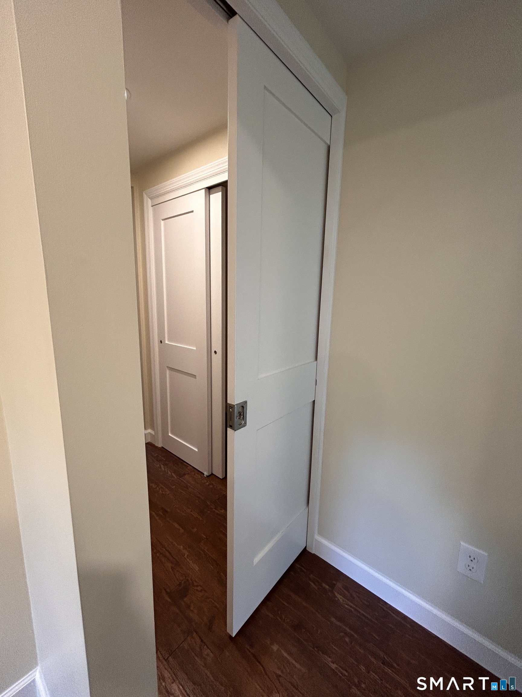 93 Campville Road Litchfield, CT 06778 - Photo 32 of 40 Privacy pocket door ahead of Primary Bedroom and Primary Bathroom Suites