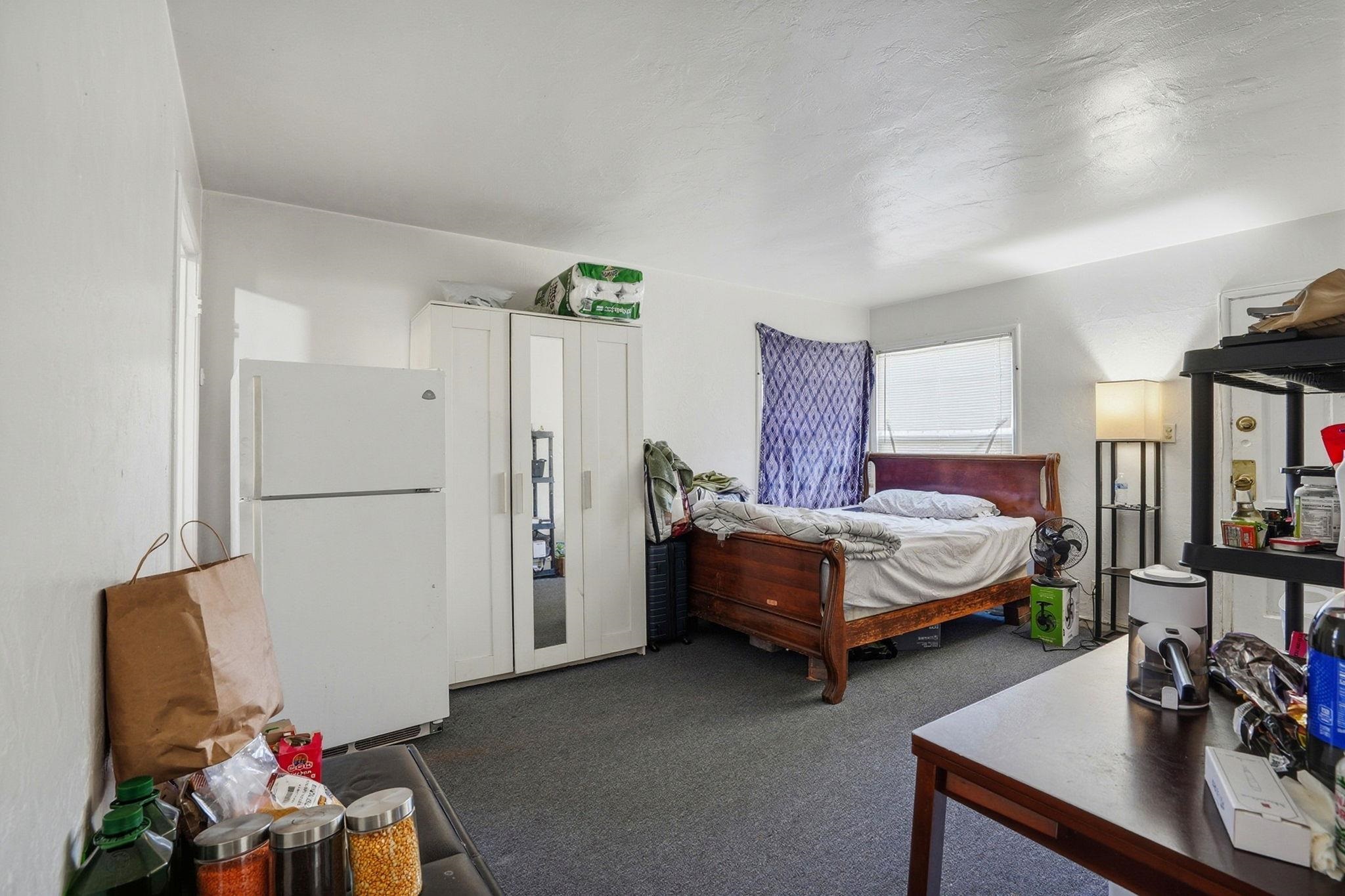 3224 Sacramento Street Berkeley, CA 94702 - Photo 13 of 21 a bedroom with a bed and a couch