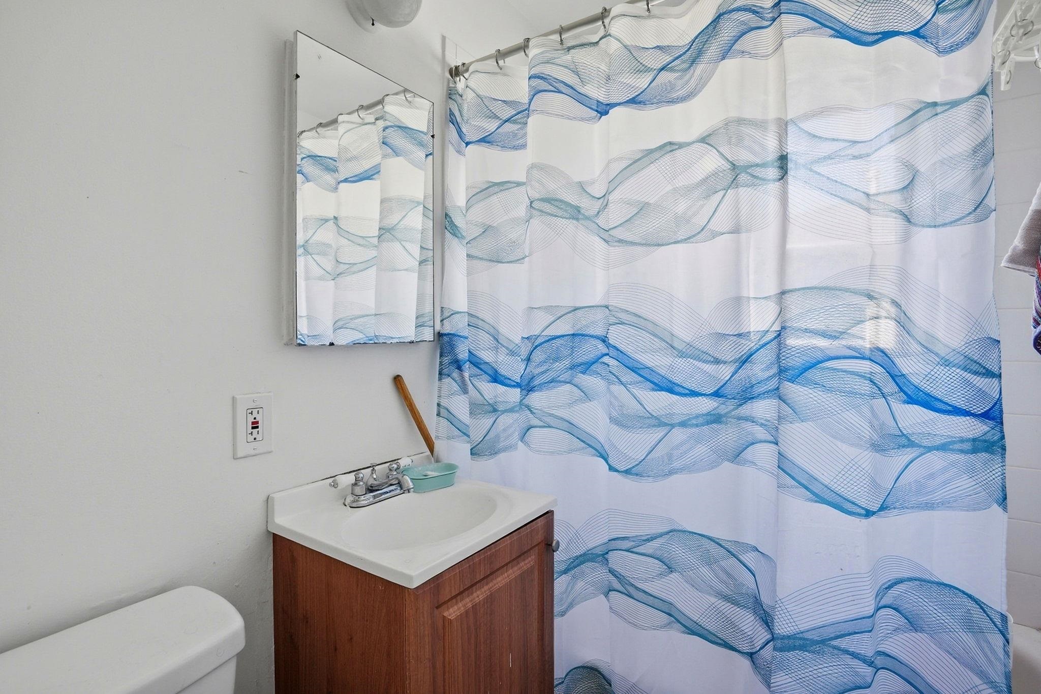 3224 Sacramento Street Berkeley, CA 94702 - Photo 19 of 21 a bathroom with a sink toilet and vanity