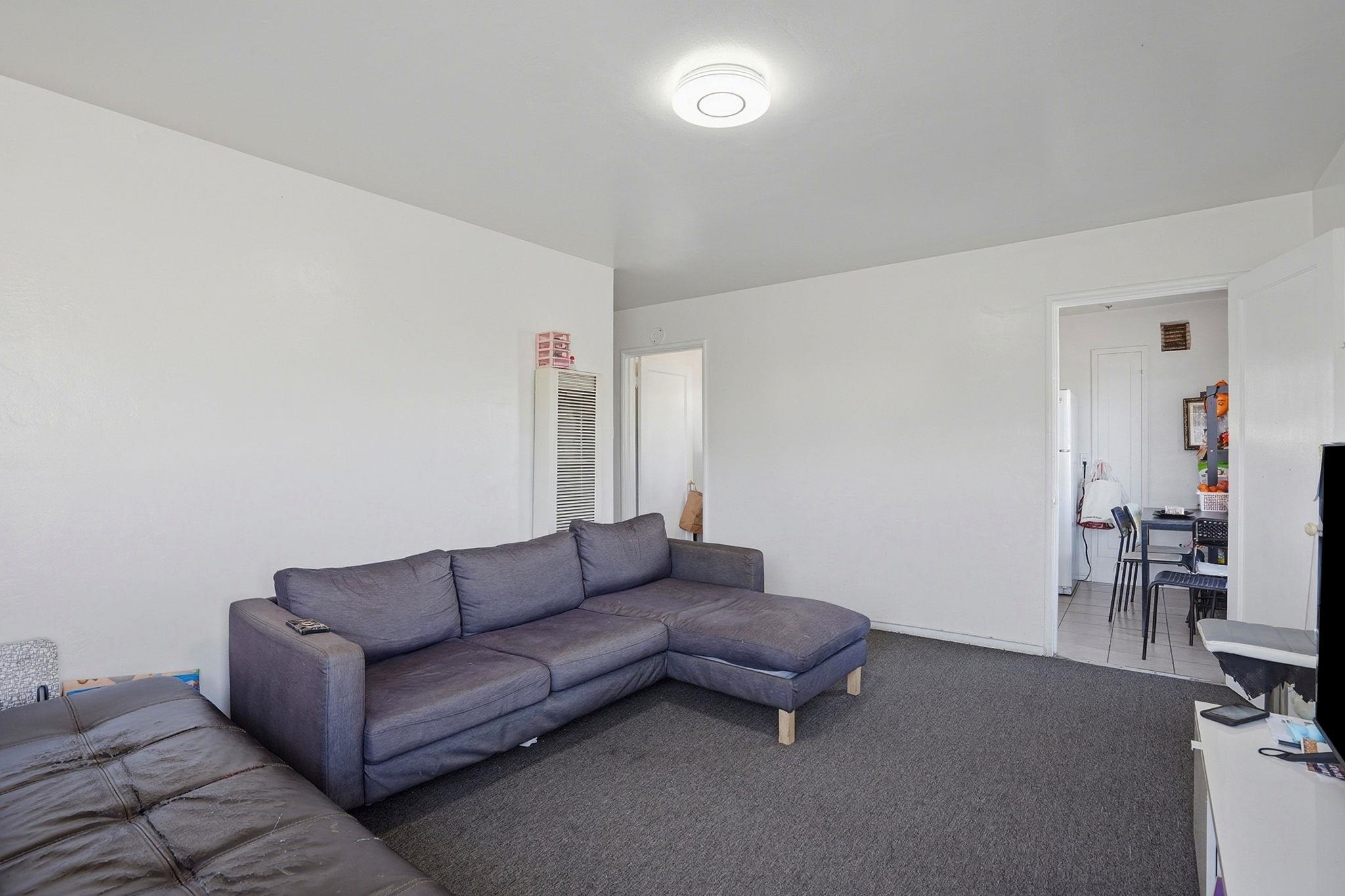 3224 Sacramento Street Berkeley, CA 94702 - Photo 8 of 21 a living room with furniture and a couch