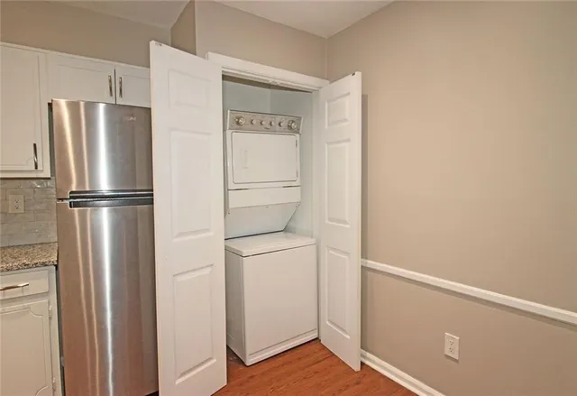 a view of a livingroom with furniture wooden floor and a window