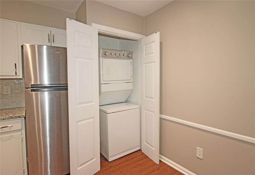38 La Rue Place Northwest Atlanta, GA 30327 - Photo 14 of 78 a walk in closet with wooden floor