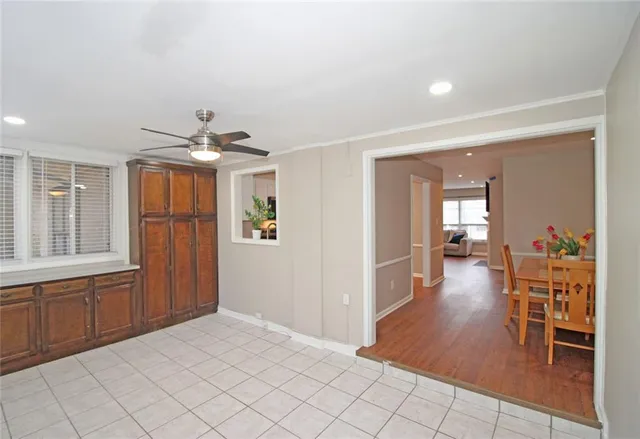 a bathroom with a granite countertop sink a toilet and shower