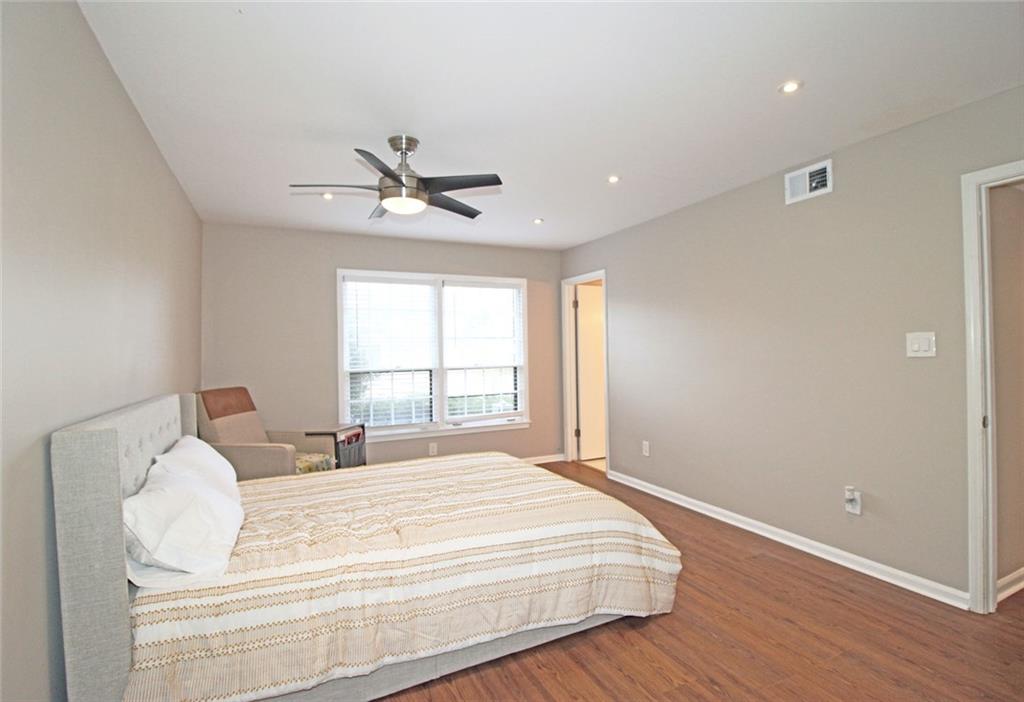38 La Rue Place Northwest Atlanta, GA 30327 - Photo 20 of 78 a bedroom with a bed and a window