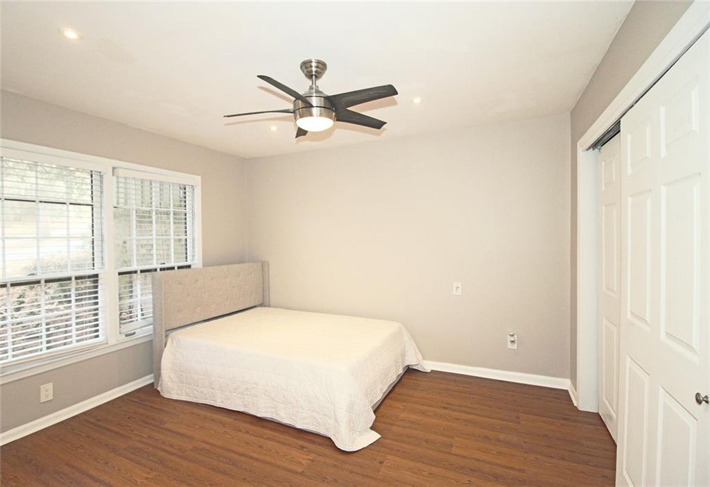 38 La Rue Place Northwest Atlanta, GA 30327 - Photo 25 of 78 a bedroom with a bed and a window