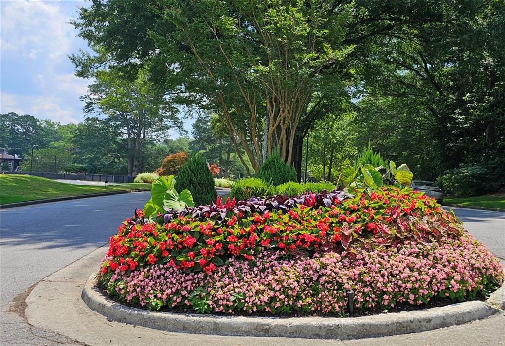 38 La Rue Place Northwest Atlanta, GA 30327 - Photo 37 of 78 a view of a wooden bench in a garden