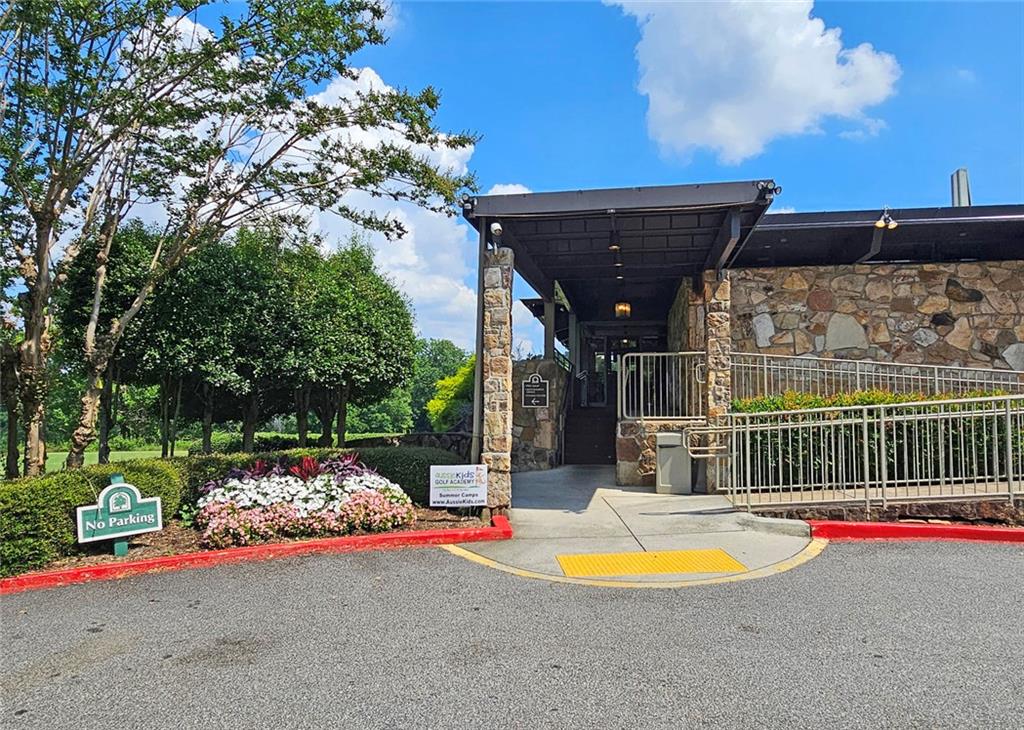38 La Rue Place Northwest Atlanta, GA 30327 - Photo 41 of 78 a view of a patio with a table and chairs