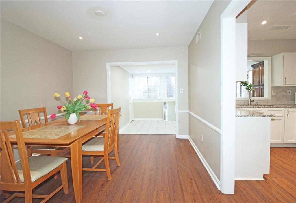 38 La Rue Place Northwest Atlanta, GA 30327 - Photo 5 of 78 a view of a dining room with furniture and wooden floor