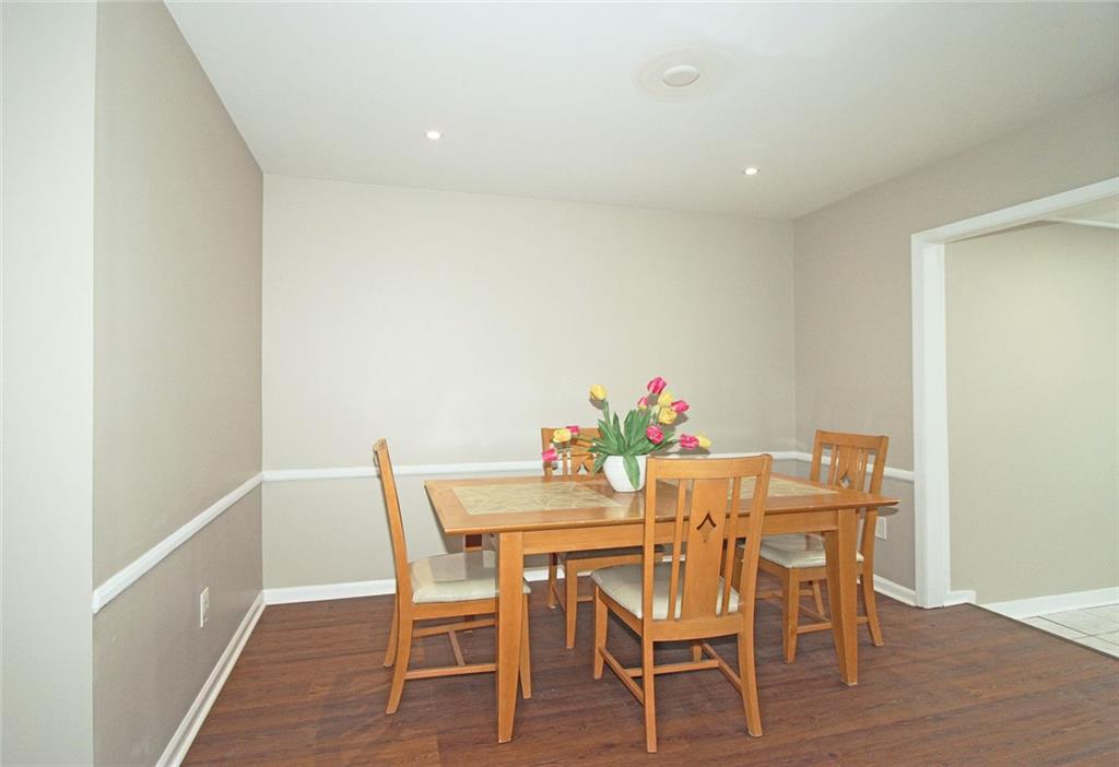 38 La Rue Place Northwest Atlanta, GA 30327 - Photo 6 of 78 a dining room with furniture and wooden floor