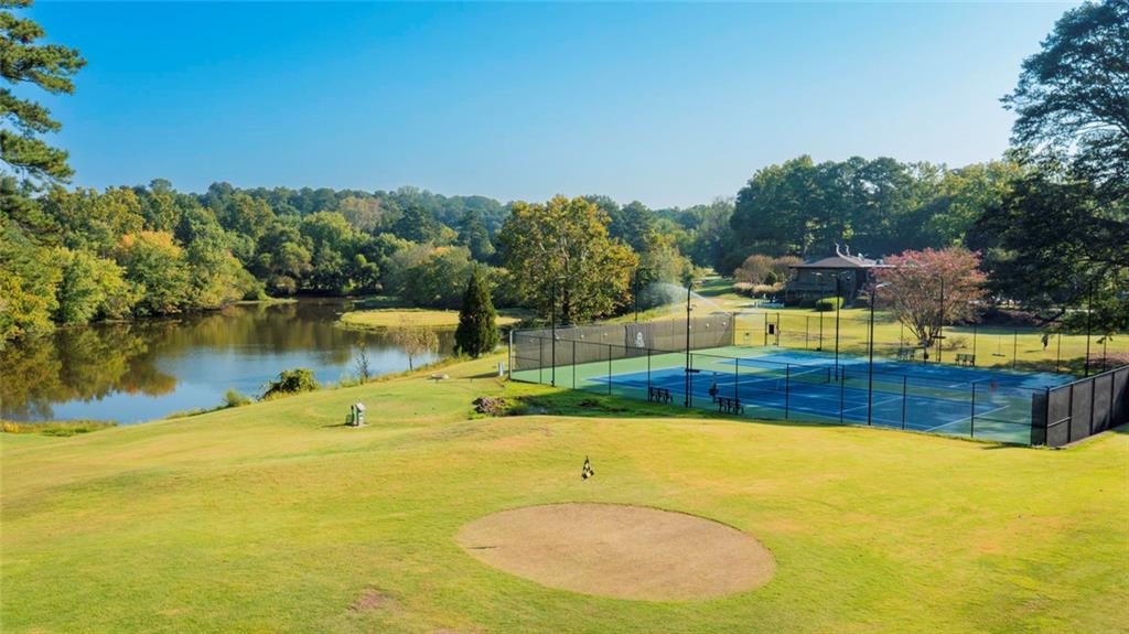 38 La Rue Place Northwest Atlanta, GA 30327 - Photo 64 of 78 a view of a swimming pool with a patio and a yard
