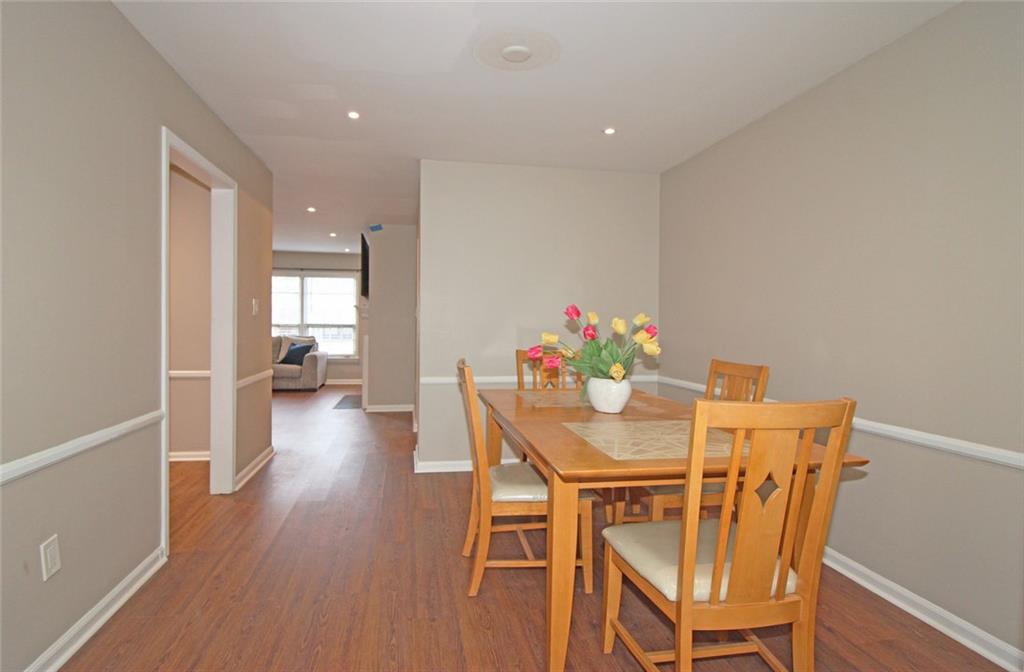38 La Rue Place Northwest Atlanta, GA 30327 - Photo 7 of 78 a view of a dining room with furniture and wooden floor