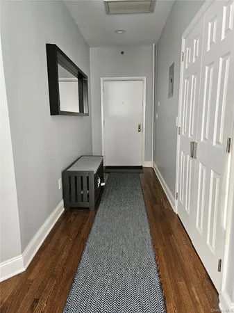 a living room with a bed and a table