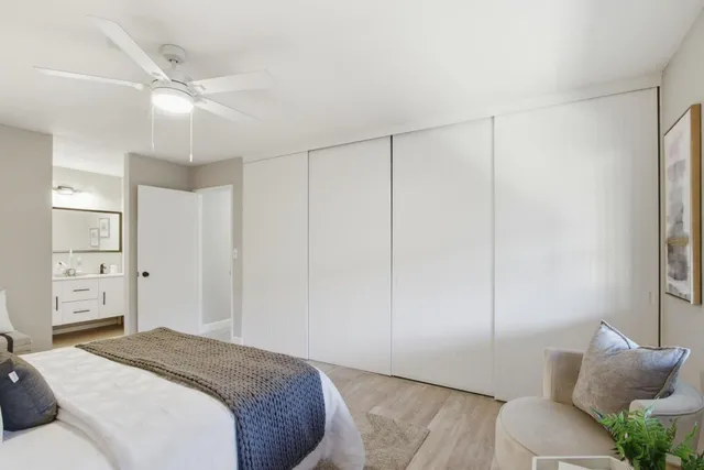 a spacious bedroom with a bed and a couch