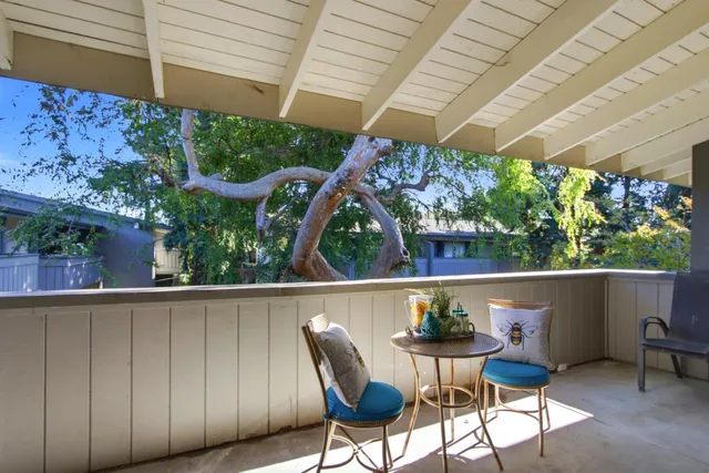 a view of table and chairs in patio