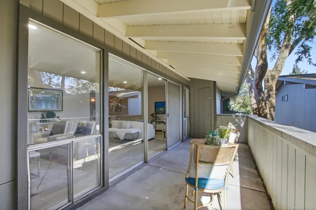 a room with dining table and chairs