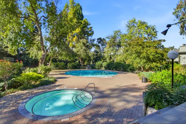a view of a swimming pool with a yard
