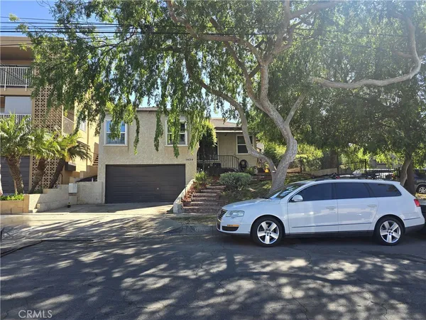 a view of a car in front of a house