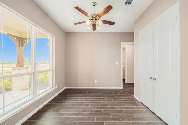 a view of an empty room and window