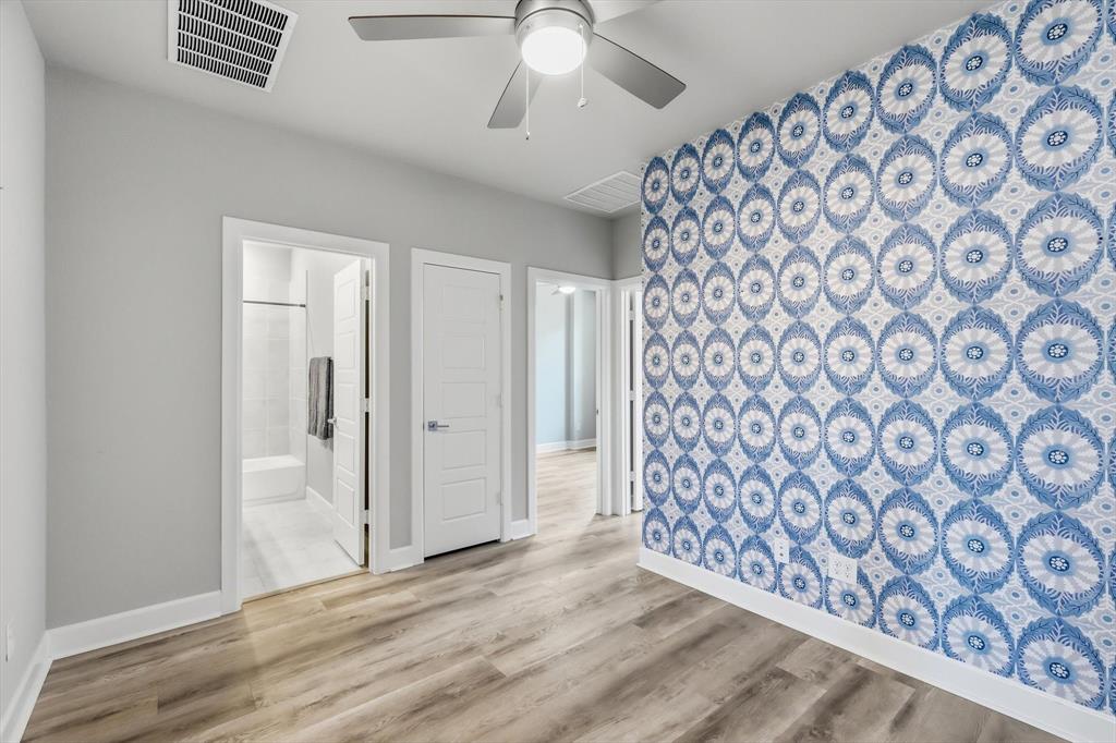 7129 Laurel Ridge Dallas, TX 75231 - Photo 22 of 35 At top of stairs this flex space can be used as a game room, office or fitness space.
