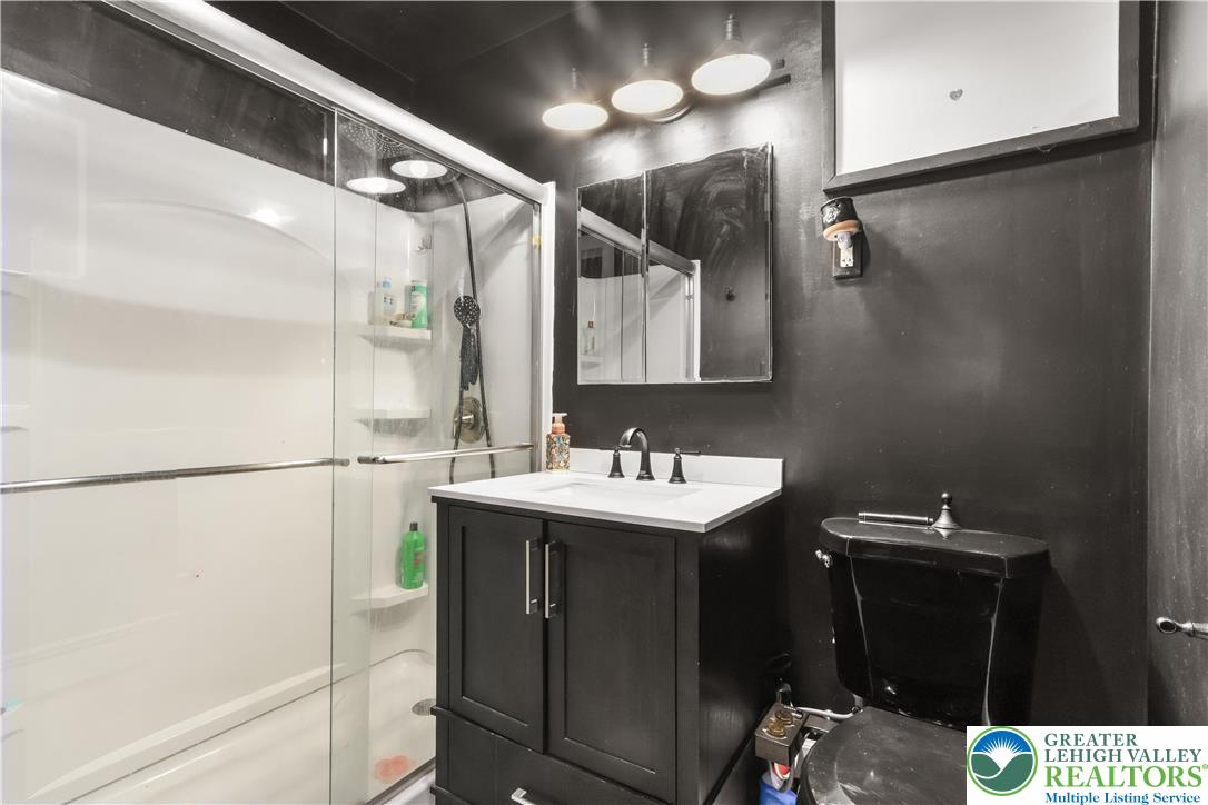 1042 Neffs Laurys Road Laurys Station, PA 18059 - Photo 20 of 27 a bathroom with a sink and mirror