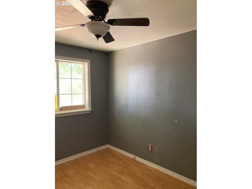 605 Southwest Nye Avenue Pendleton, OR 97801 - Photo 12 of 36 a view of an empty room with a window