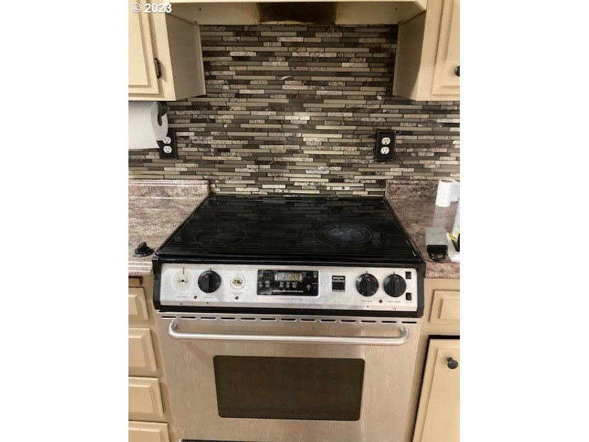 605 Southwest Nye Avenue Pendleton, OR 97801 - Photo 9 of 36 a stove top oven sitting inside of a kitchen