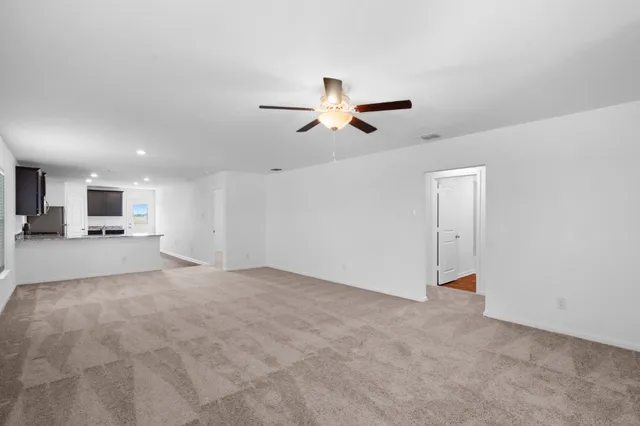 a view of a livingroom with a ceiling fan
