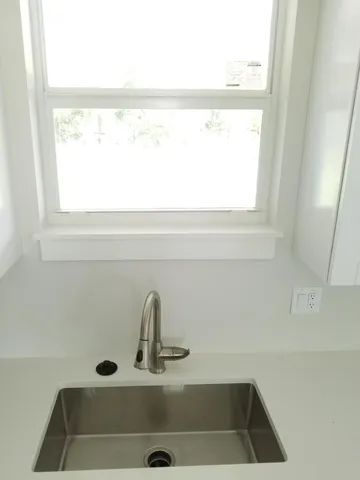 a close view of sink and a window