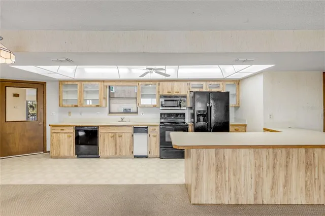 a view of an empty room with glass door