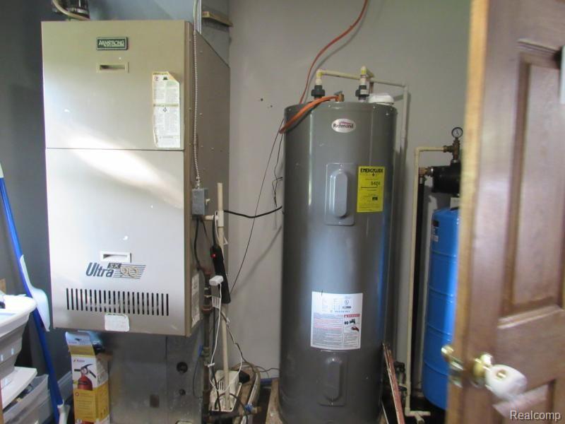 6020 Sheridan Road Vassar, MI 48768 - Photo 21 of 24 Furnace, hot water heater, and water system.