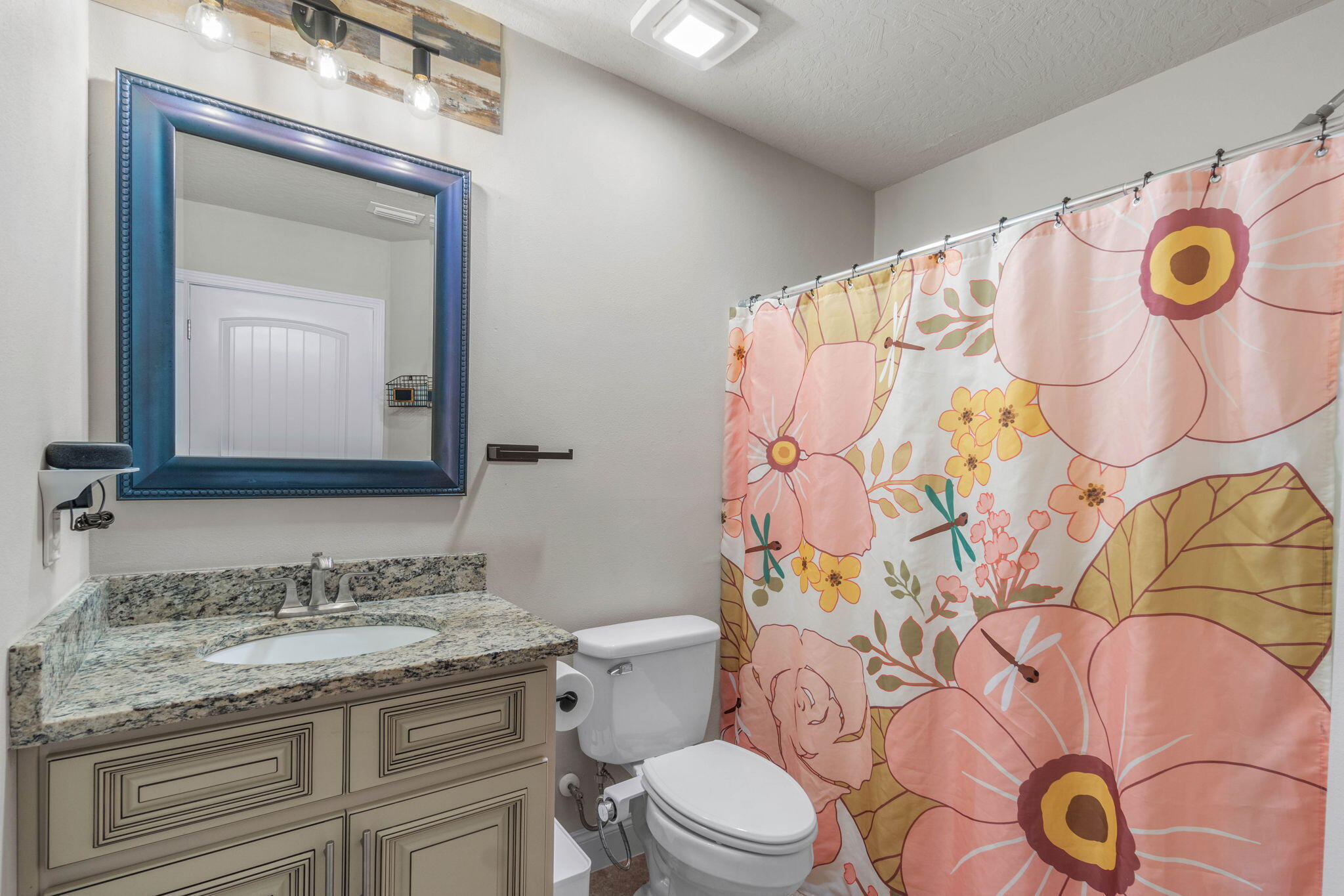 4746 Chanson Crossing Crestview, FL 32539 - Photo 12 of 21 a bathroom with a granite countertop toilet sink and mirror