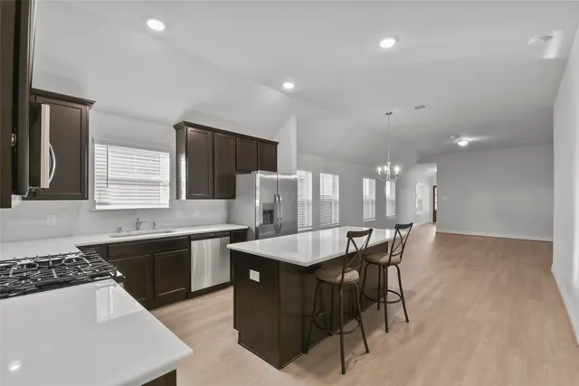 a kitchen with a table and chairs in it