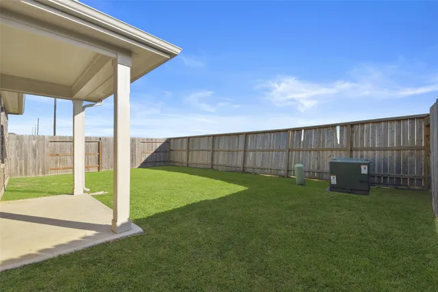 a view of backyard with green space