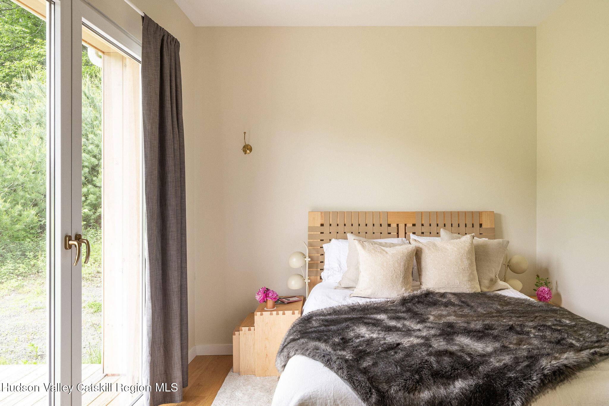 129 Krum Road Kerhonkson, NY 12446 - Photo 12 of 42 a bed sitting in a bedroom next to a window