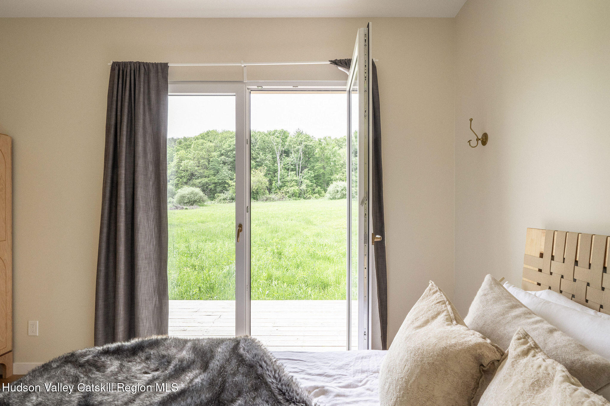 129 Krum Road Kerhonkson, NY 12446 - Photo 14 of 42 a bedroom with a bed and a window