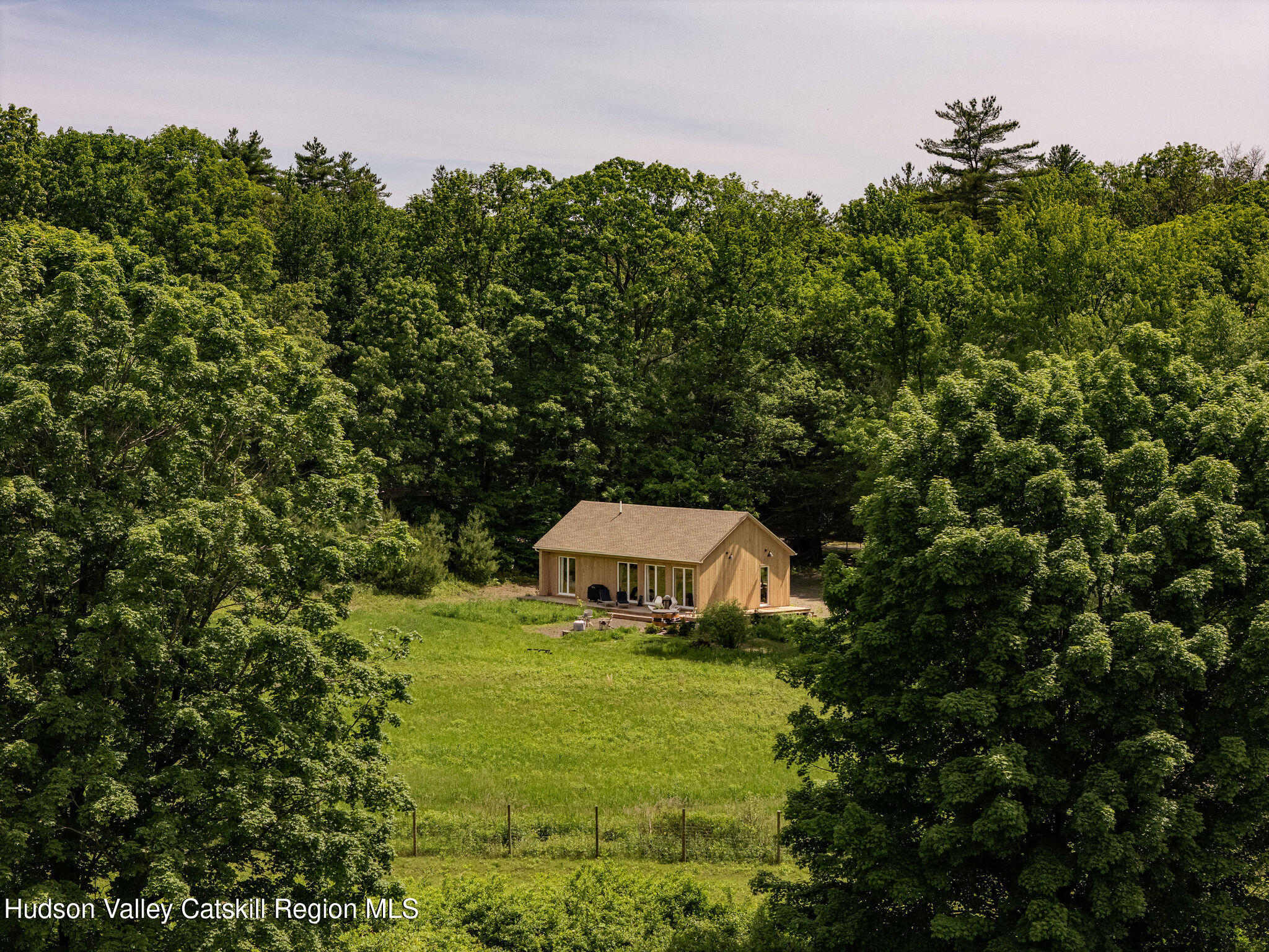 129 Krum Road Kerhonkson, NY 12446 - Photo 24 of 42 a view of a house with a yard and sitting area