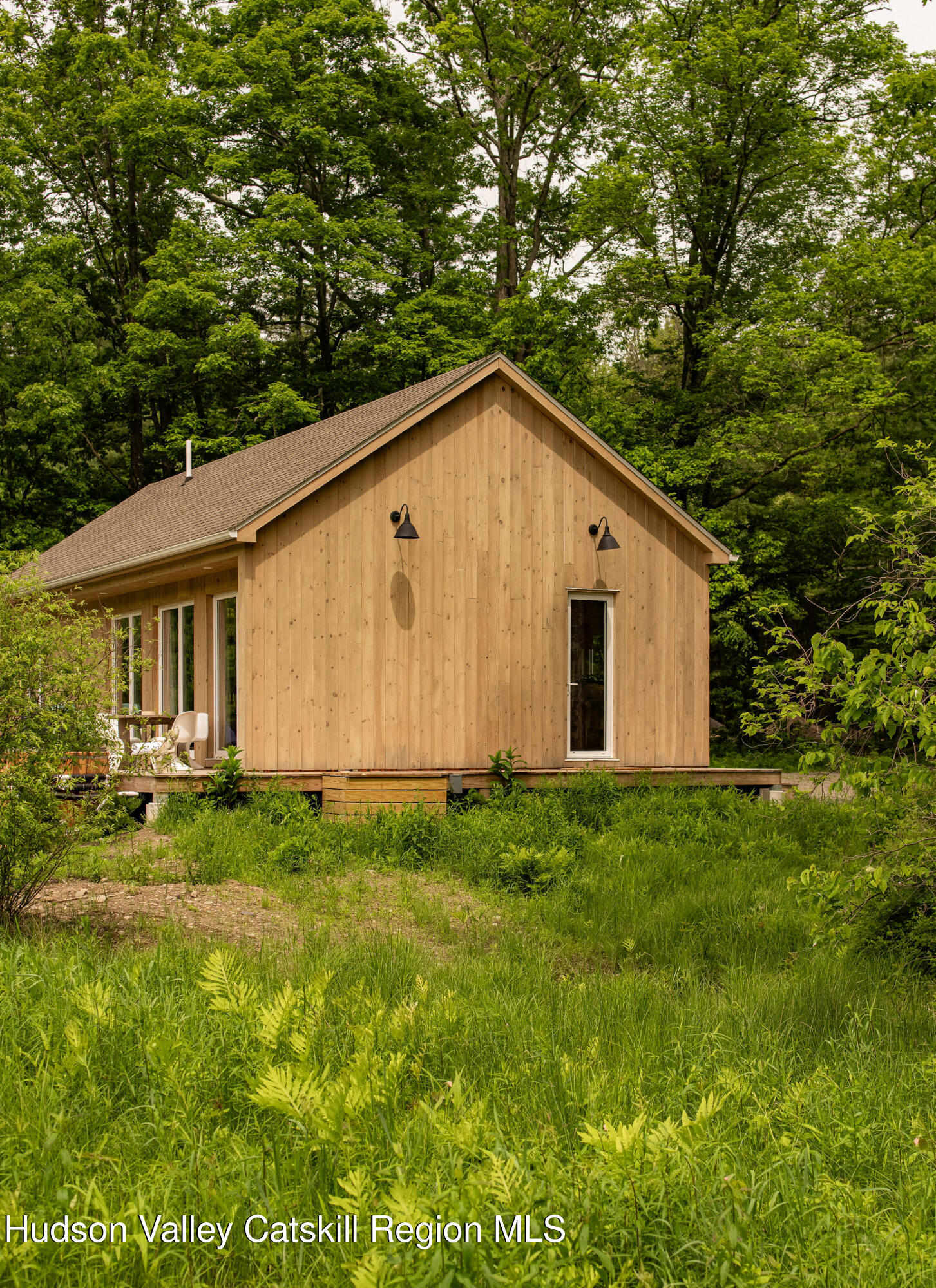 129 Krum Road Kerhonkson, NY 12446 - Photo 36 of 42 a view of a backyard with plants and a bench