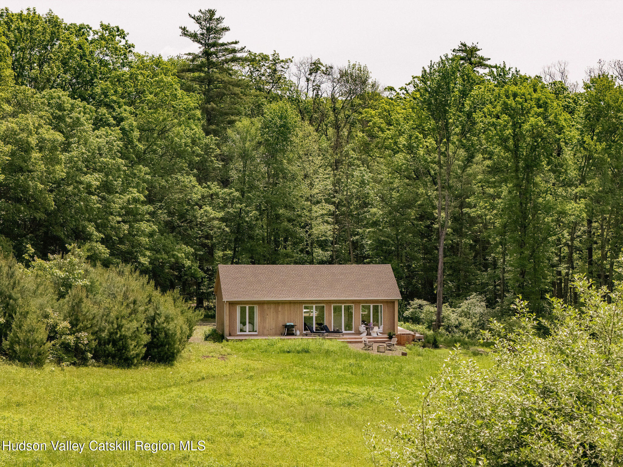 129 Krum Road Kerhonkson, NY 12446 - Photo 41 of 42 a house with trees in front of it