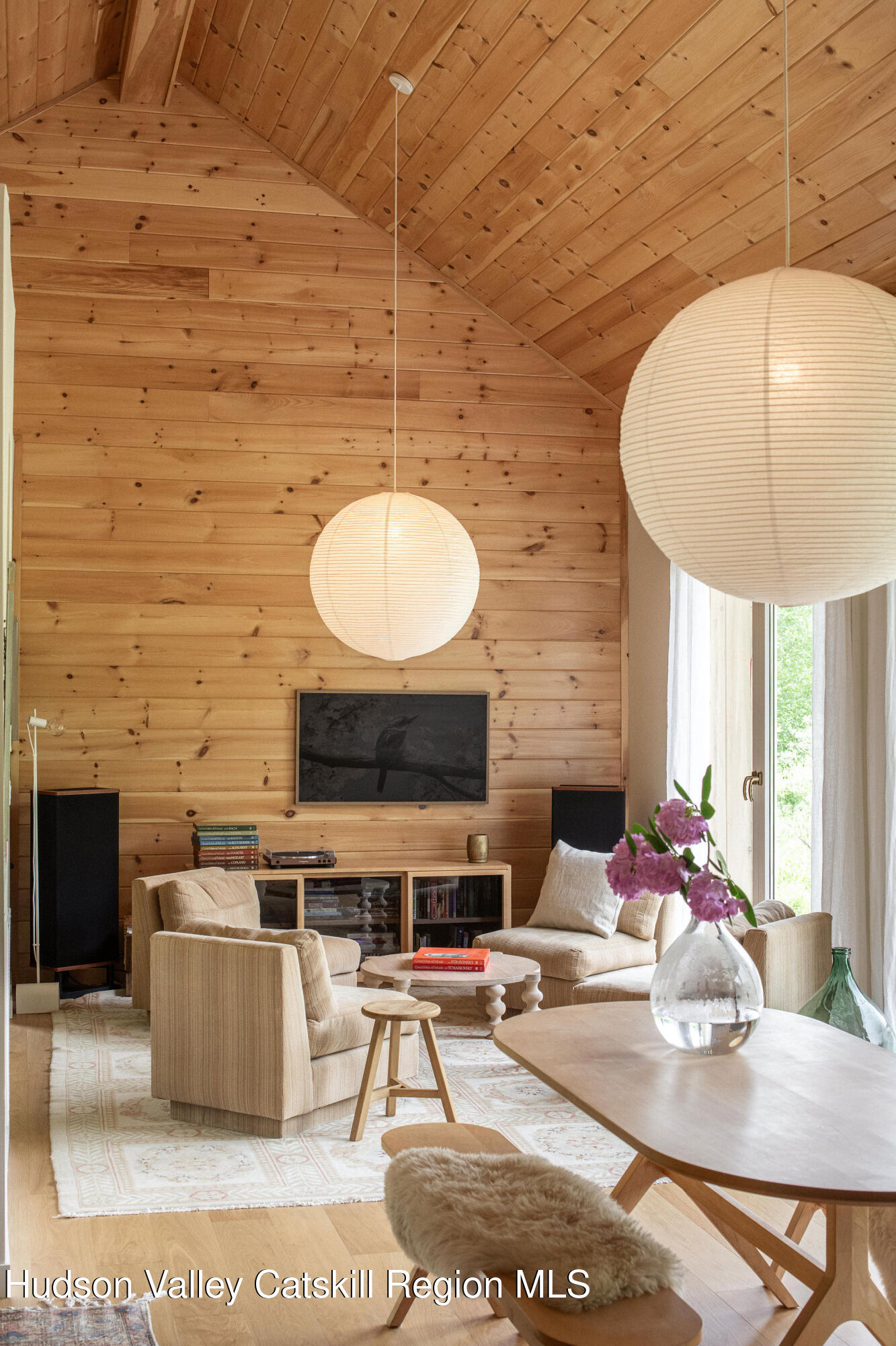 129 Krum Road Kerhonkson, NY 12446 - Photo 5 of 42 a living room with a table a fireplace and a counter top space