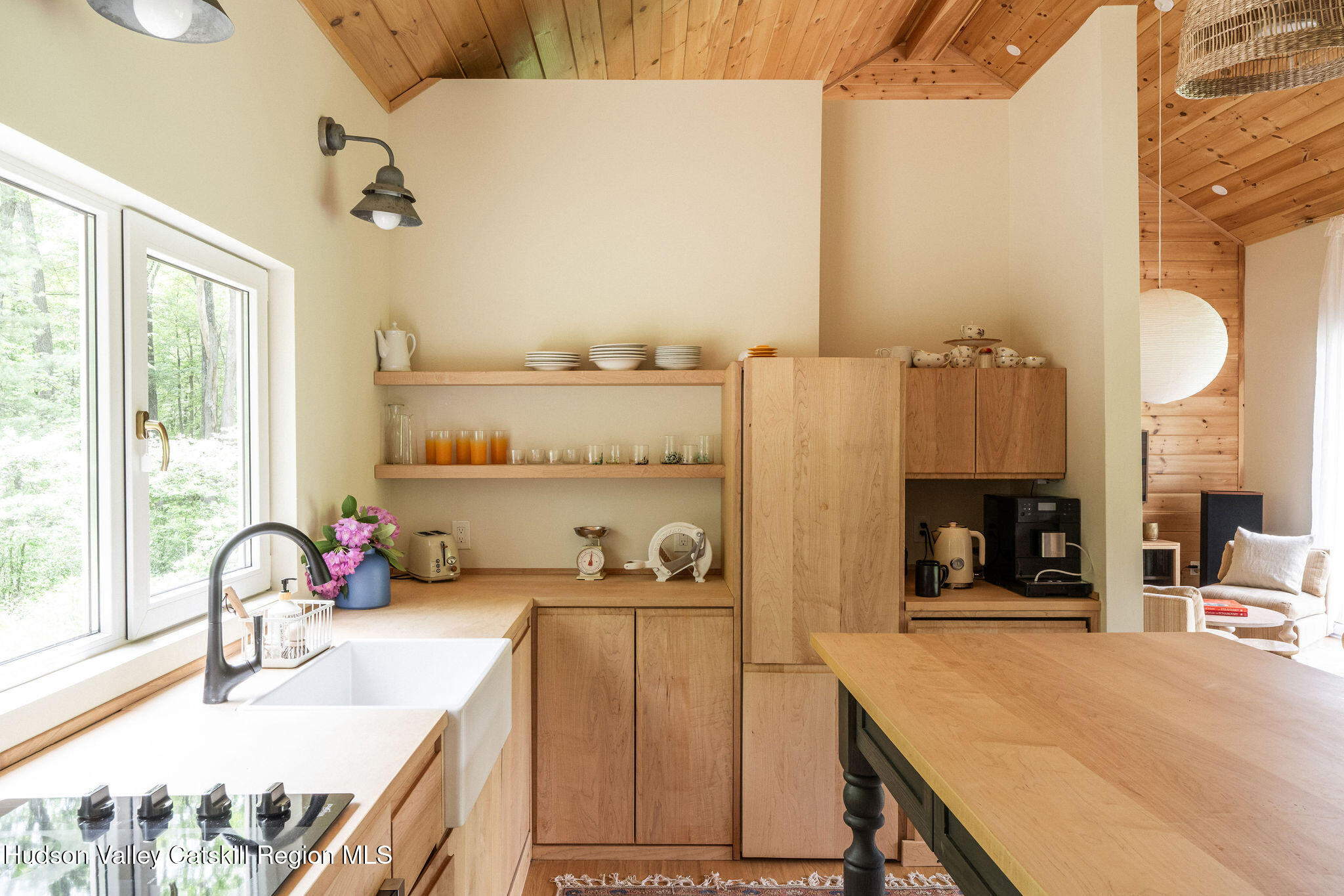 129 Krum Road Kerhonkson, NY 12446 - Photo 9 of 42 a kitchen with a table chairs and a stove