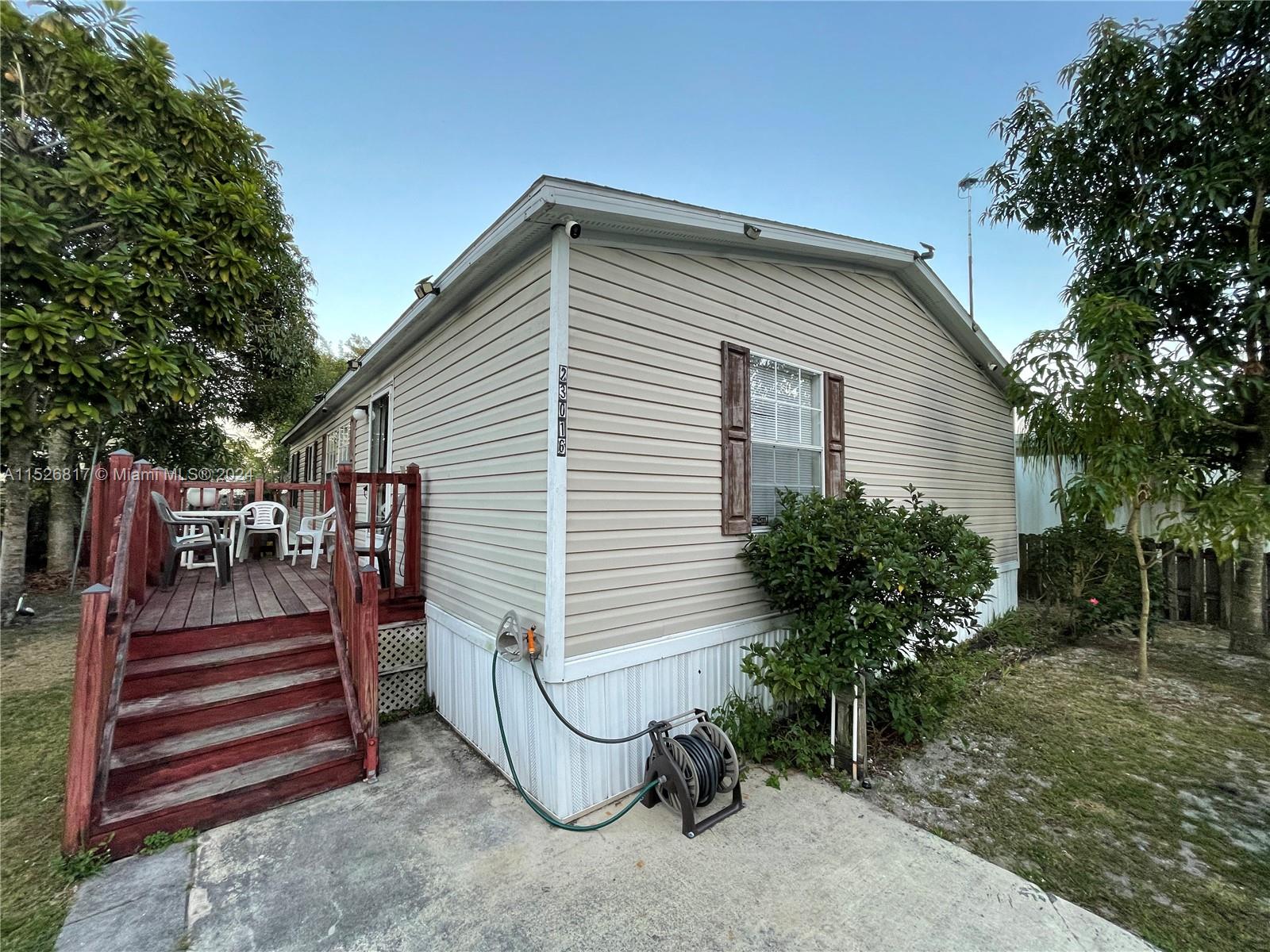 23016 Watergate Circle Boca Raton, FL 33428 - Photo 1 of 25 a view of a house with a yard and sitting area