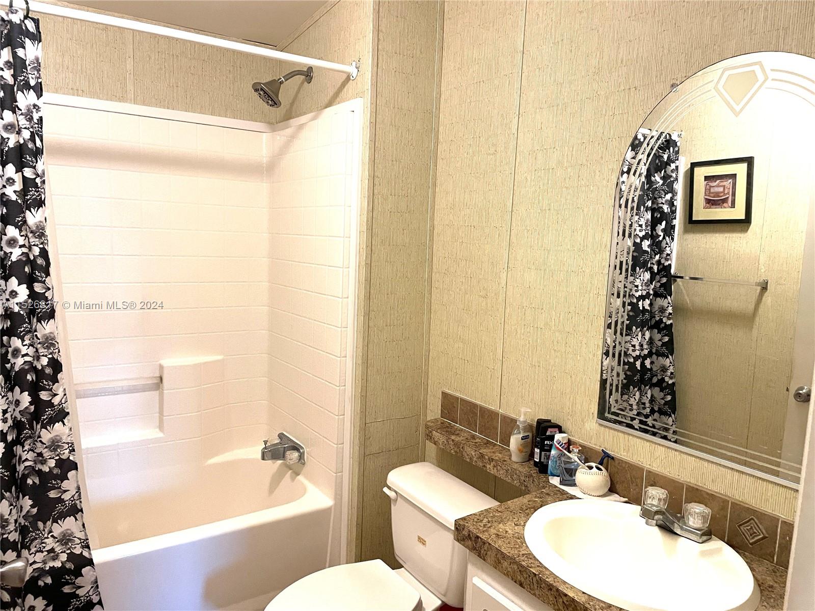 23016 Watergate Circle Boca Raton, FL 33428 - Photo 15 of 25 a bathroom with a sink mirror toilet and bathtub