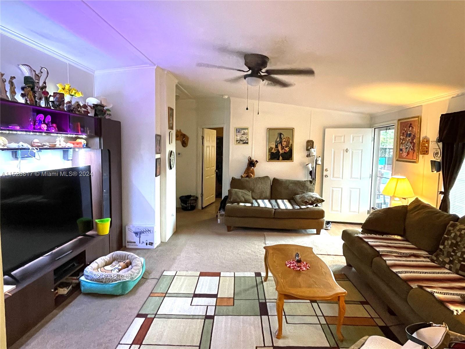 23016 Watergate Circle Boca Raton, FL 33428 - Photo 20 of 25 a living room with furniture and a flat screen tv