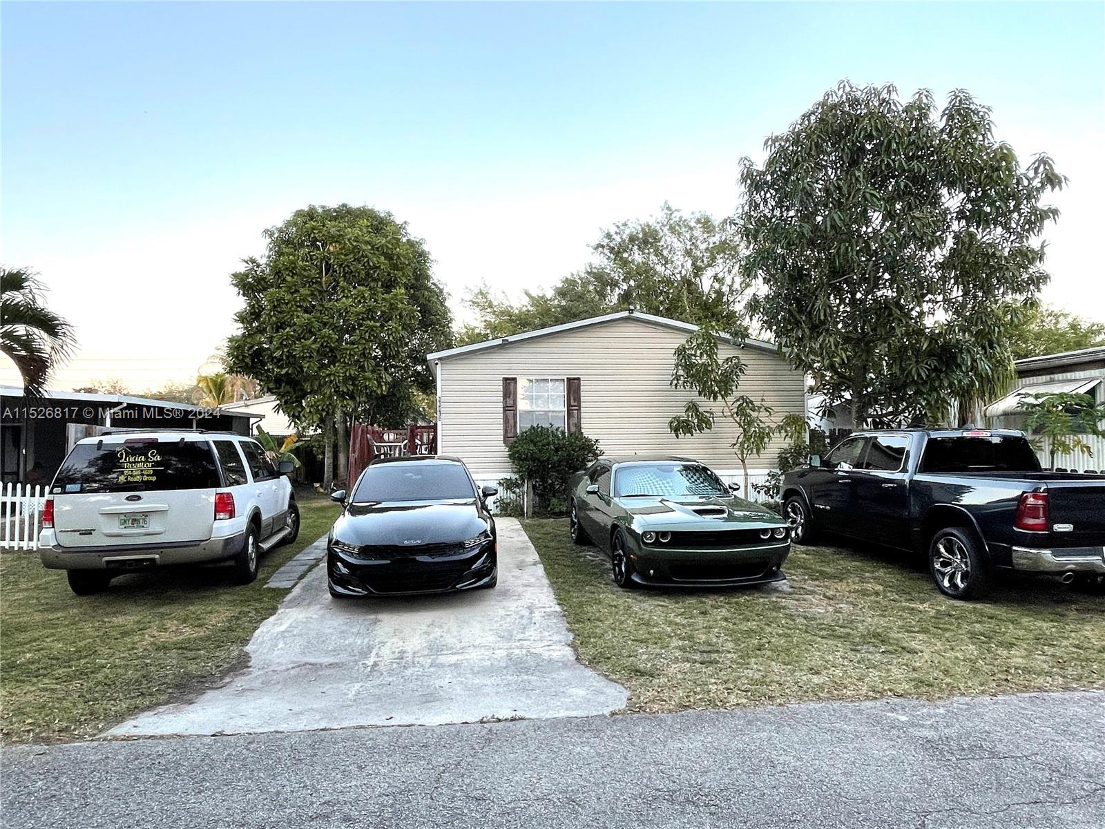 23016 Watergate Circle Boca Raton, FL 33428 - Photo 2 of 25 a view of a cars parking space