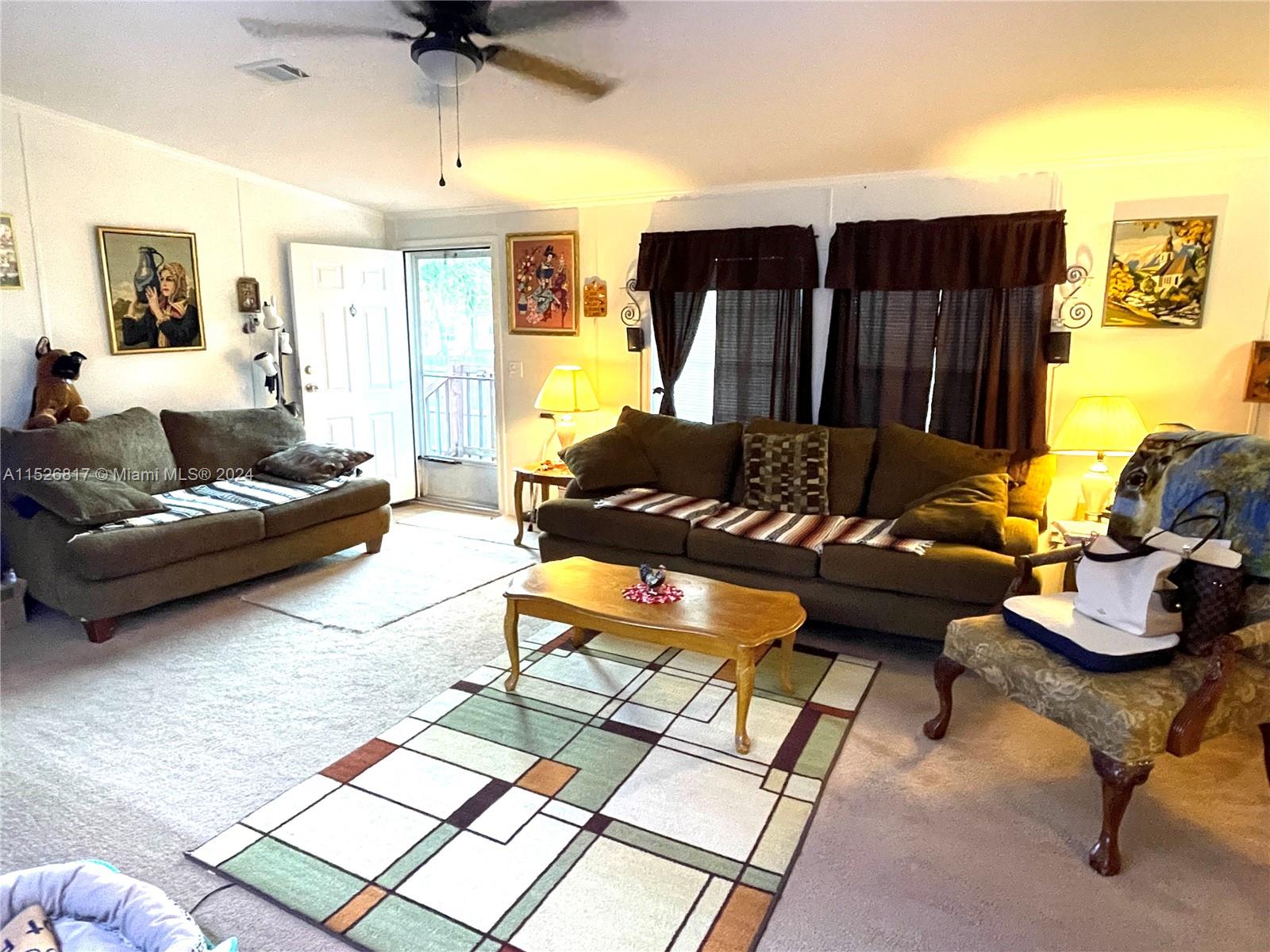 23016 Watergate Circle Boca Raton, FL 33428 - Photo 21 of 25 a living room with furniture and a wooden floor