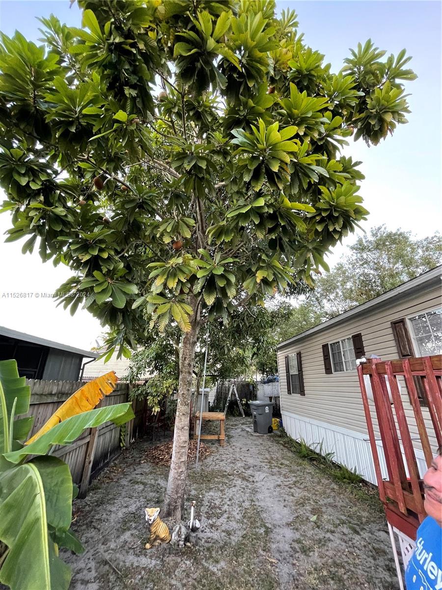 23016 Watergate Circle Boca Raton, FL 33428 - Photo 8 of 25 a backyard of a house with seating space